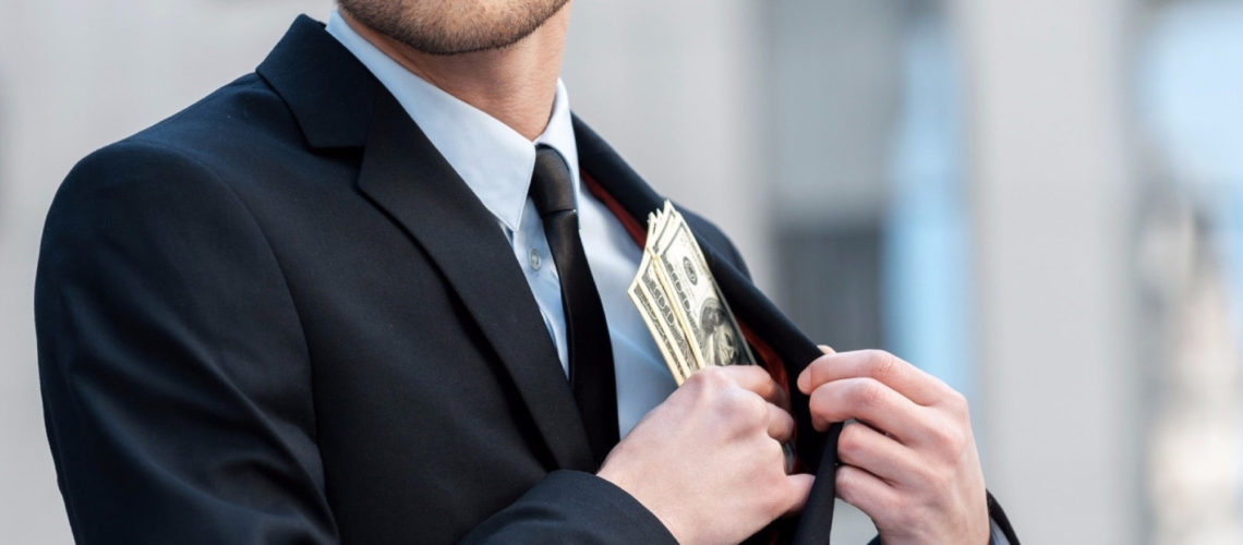 20151124143042-man-money-pocket-stealing-embezzlement-investors-businessman-financial-wealth-worker-dishonesty-criminal-currency-dollar
