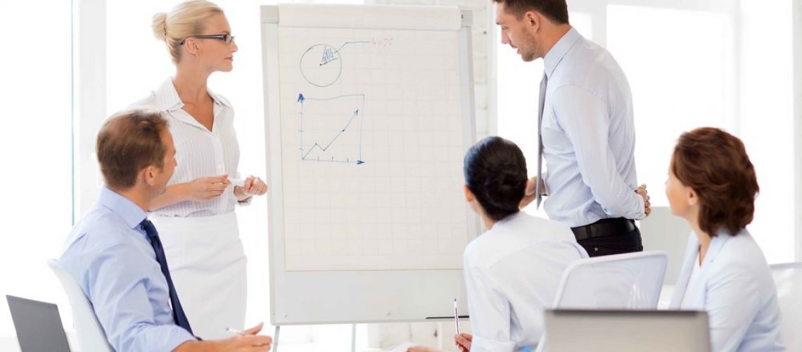 smiling business team discussing something in office