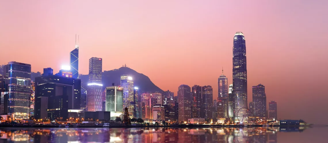 ey-hong-kong-neon-sunset-iconic-harbour-skyscrapers
